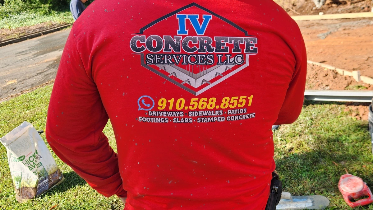 Aerial view of a freshly poured concrete driveway on a Charlotte home